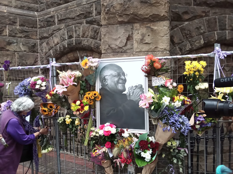 Joan Shippey held back tears when she placed flowers at the St George's Cathedral in remembrance of Archbishop Emeritus Desmond Tutu.