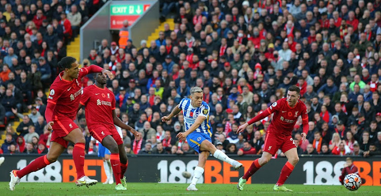 Leandro Trossard of Brighton & Hove Albion scores their second goal during the Premier League match between Liverpool and Brighton & Hove Albion at Anfield on October 30, 2021 in Liverpool, England.