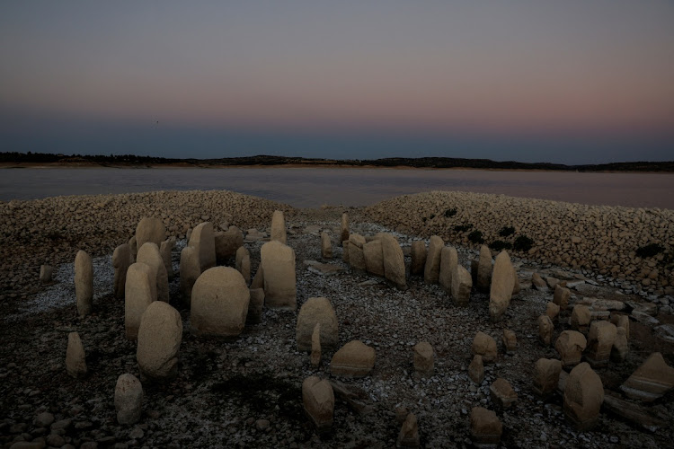 The dolmen of Guadalperal, also known as the Spanish Stonehenge, is seen due to the receding waters of the Valdecanas reservoir in the outskirts of El Gordo.