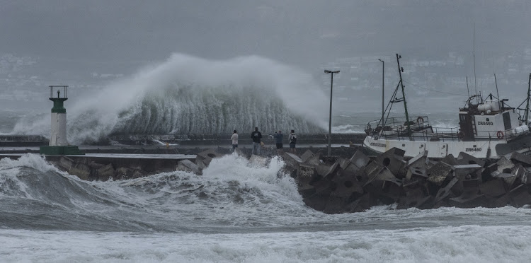 Large waves and strong wind battered Kalk Bay harbour in Cape Town.