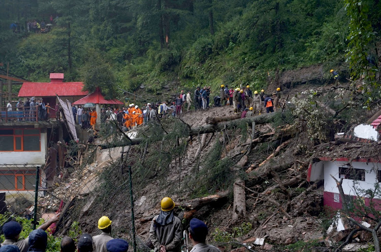 Rescue workers remove the debris as they search for survivors after a landslide following torrential rain in Shimla in the northern state of Himachal Pradesh, India, on August 14, 2023. Picture: REUTERS