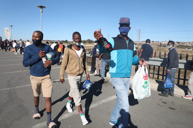 Patrons buy alcohol in Tembisa