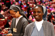 Kenyan nun Lucy Nderi smiles before the start of a synod session led by pope Francis at the Vatican last week. 