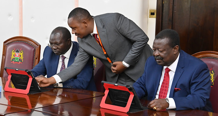 CS for Co-operative and SMEs Simon Chelugui and Prime Secretary cabinet Musalia Mudavadi during the first paperless Cabinet meeting at State House on January 31, 2023