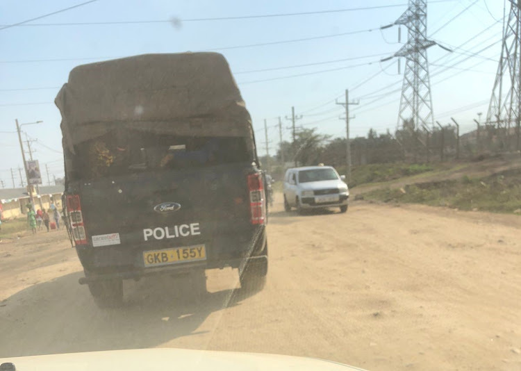 Police officers who were allegedly at the scene of incident where KRA officers were assaulted after impounding illicit brews in Mamboleo, Kisumu East subcounty on Monday.