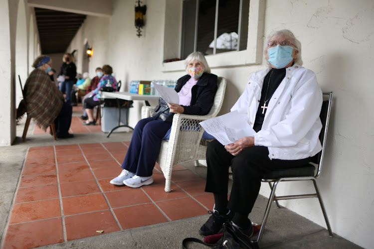 Sisters Barbara Stowasser, 82, and Barbara Sullivan, 84, wait to receive a coronavirus disease (Covid-19) vaccine at a vaccination drive for retired nuns at the Sisters of St. Joseph of Carondelet independent living center in Los Angeles, California, US, March 3, 2021.