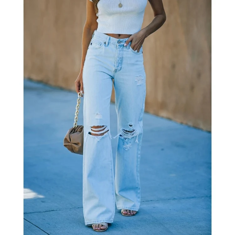 Dames denim wide-leg broek, gewassen, ripped, casual, import. Comfortabele en trendy jeansbroek, ideaal voor een casual en relaxte uitstraling.