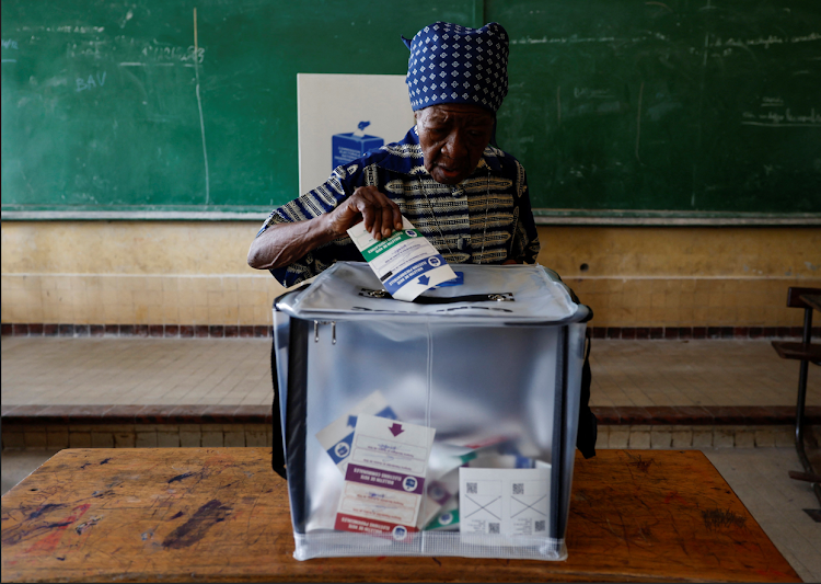 An elderly woman casts her ballot at a polling station on the day of the presidential election, in Kinshasa, the Democratic Republic of Congo on December 20 2023.