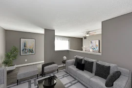 View of staged living room with grey walls