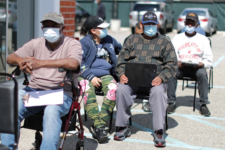 People wait to receive a second coronavirus disease (COVID-19) vaccination, in Los Angeles, California, U.S., March 12 2021.