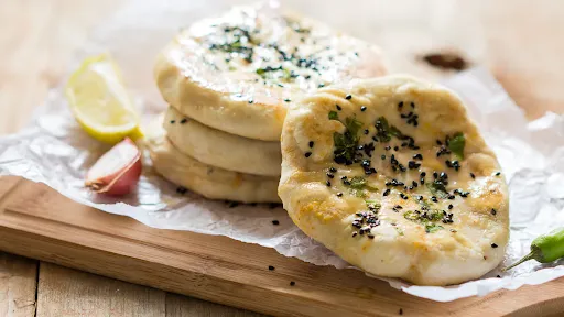 Paneer Kulcha With Chole And Onion Salad