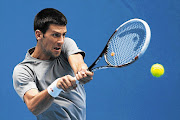 Novak Djokovic of Serbia hopes to make it three wins in a row at the 2013 Australian Open in Melbourne Picture: ROBERT PREZIOSO/GETTY IMAGES