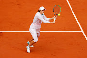 Iga Swiatek of Poland plays a backhand during her Women's Singles semifinals match against Nadia Podoroska of Argentina on day twelve of the 2020 French Open at Roland Garros on October 08, 2020 in Paris, France.