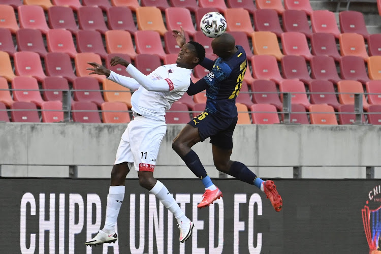 Silas Maziya of Chippa United and Khuliso Mudau of Sundowns tussle during the DStv Premiership game at the Nelson Mandela Bay Stadium on Tuesday.