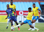 Lerato Lamola of Marumo Gallants challenged by Lesedi Kapinga of Mamelodi Sundowns during the league match at Loftus Versfeld Stadium on December 23 2021 in Pretoria. 