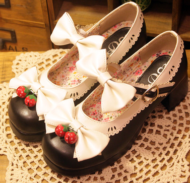 Lolita strawberry bow round head thick women's shoes. Enjoy comfort and style with these unique and charming shoes.