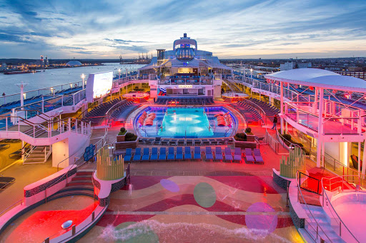 anthem.jpg - A view of the main pool deck on Anthem of the Seas at sunset.