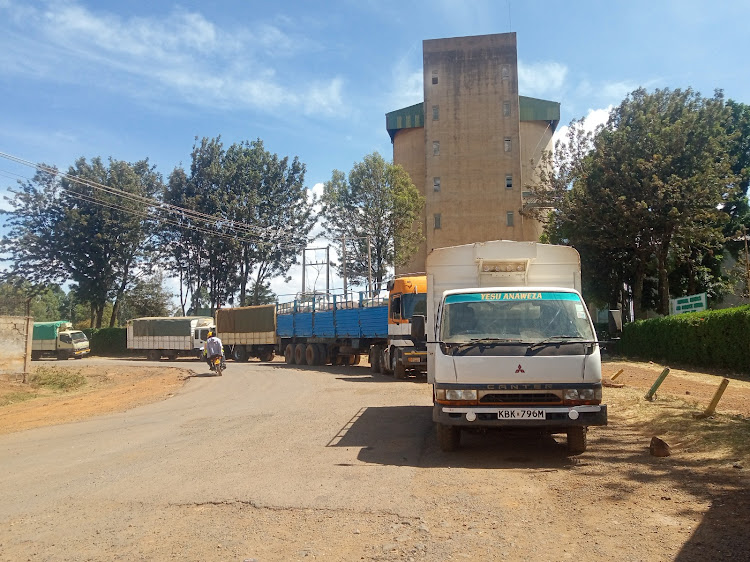 Lorries ferrying maize outside the NCPB depot in Eldoret on March 15 last year.