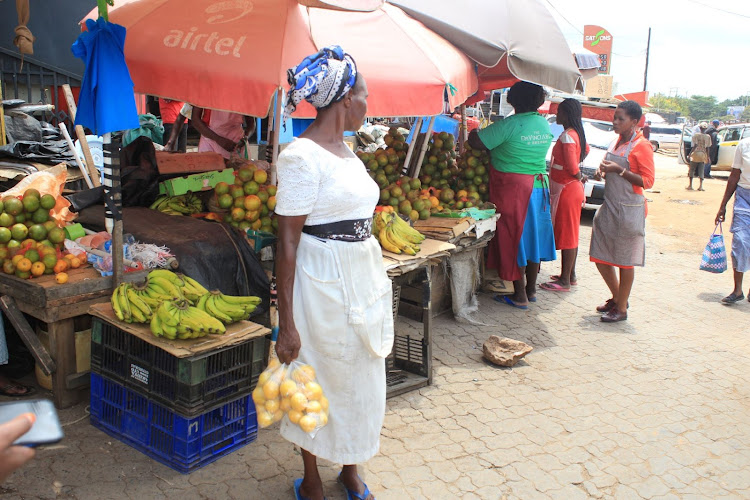 A woman hawks fruits at Garissa stage in Mwingi town.