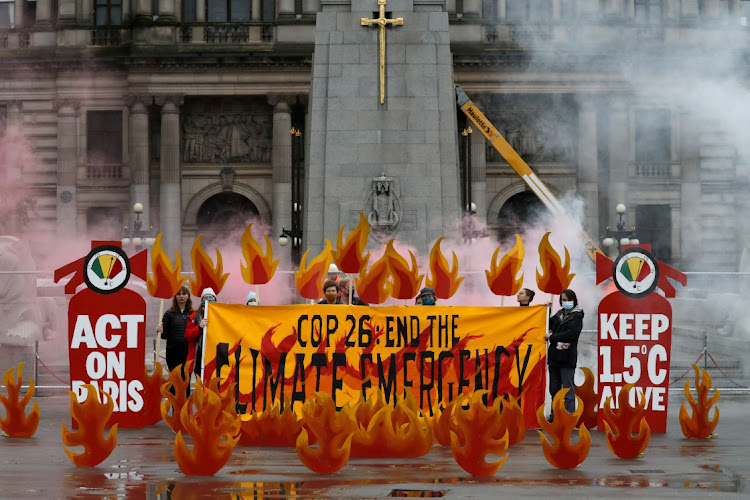 Activists stage a dramatic art installation in Glasgow to push for urgent action to slow or halt climate change. The UN Climate Change Conference COP26 started in the city on Sunday.