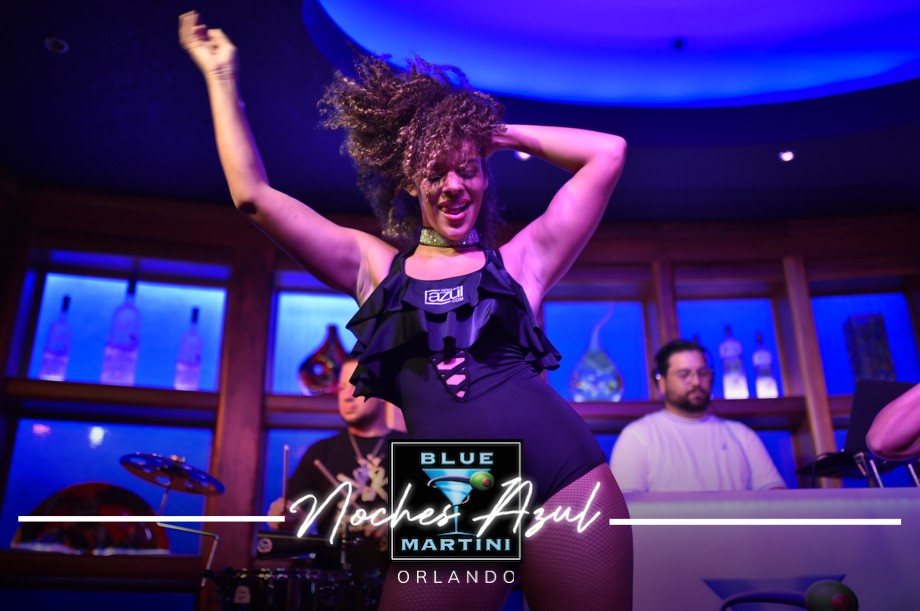 Woman dancing on stage during Noches Azul at Blue Martini