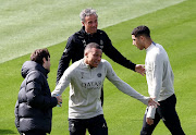 Paris St-Germain coach Luis Enrique with Kylian Mbappé and Achraf Hakimi during training at the PSG Training Centre in Poissy in Paris, France on Monday.
