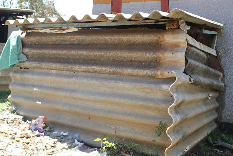 A resident at Kimalewa has used asbestos to make a chicken coop.