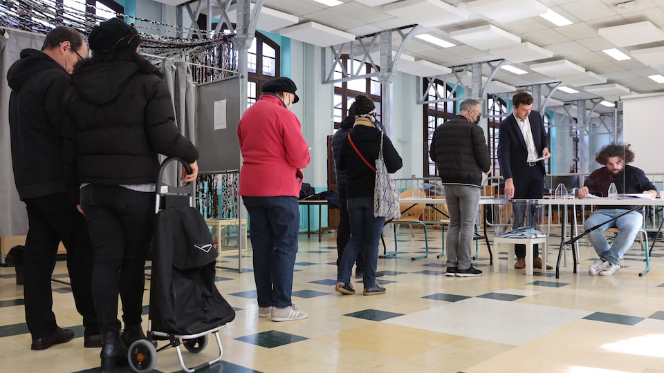 People line up to vote.