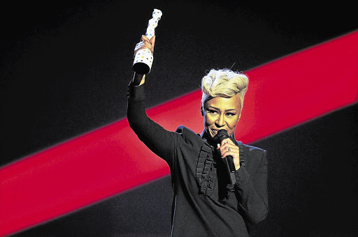 Singer Emeli Sande waves after being presented with the British Female Solo Artist award at the BRIT Awards, celebrating British pop music, at the O2 Arena in London last night