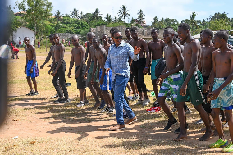 Tourism Cabinet Secretary Alfred Mutua with the youth who turned out for the NYS recruitment in Kilifi on February 7, 2024.