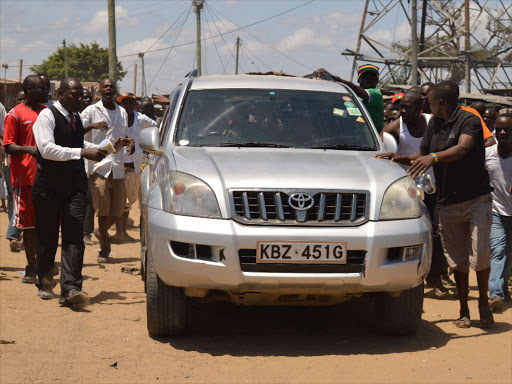 Youths from Bangla in changamwe constituency, Mombasa try to block Labour Party of Kenya leader Ababu Namwamba from leaving the area during a tour on October 23, 2016. /JOHN CHESOLI