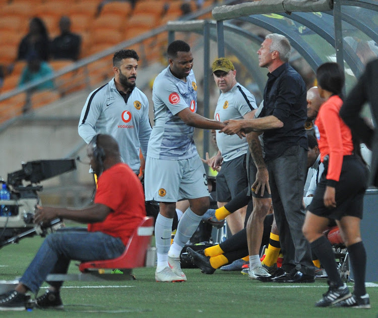 A visibly disappointed Itumeleng Khune limps off the pitch with a suspected injury.