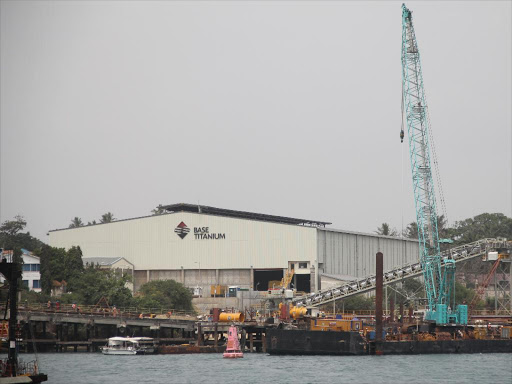 Minerals are loaded onto a cargo ship at the Base Titanium jetty in Likoni /ELKANA JACOB