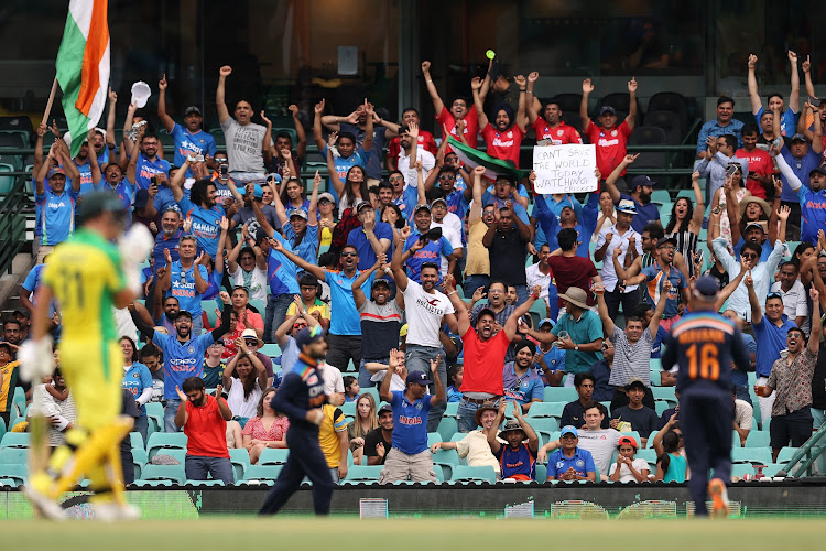 Indian fans react as Virat Kohli takes a catch to dismiss Aaron Finch of Australia during game two of the One Day International series at Sydney Cricket Ground on November 29, 2020.