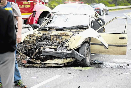 Officials at the scene near Kidd’s Beach where a Grens school bus and small passenger taxi collided Picture: MARK ANDREWS