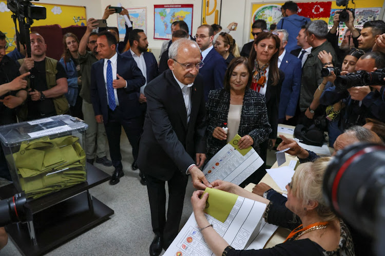 Kemal Kilicdaroglu, presidential candidate of Turkey's main opposition alliance, and his wife Selvi Kilicdaroglu attend the presidential and parliamentary elections at a polling station in Ankara, Turkey, May 14 2023. Picture: YVES HERMAN/REUTERS