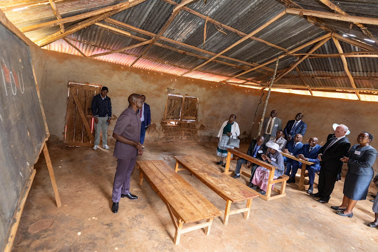 President William Ruto intercating with people at Kamagut Primary School in Turbo, Uasin Gishu on January 8, 2024