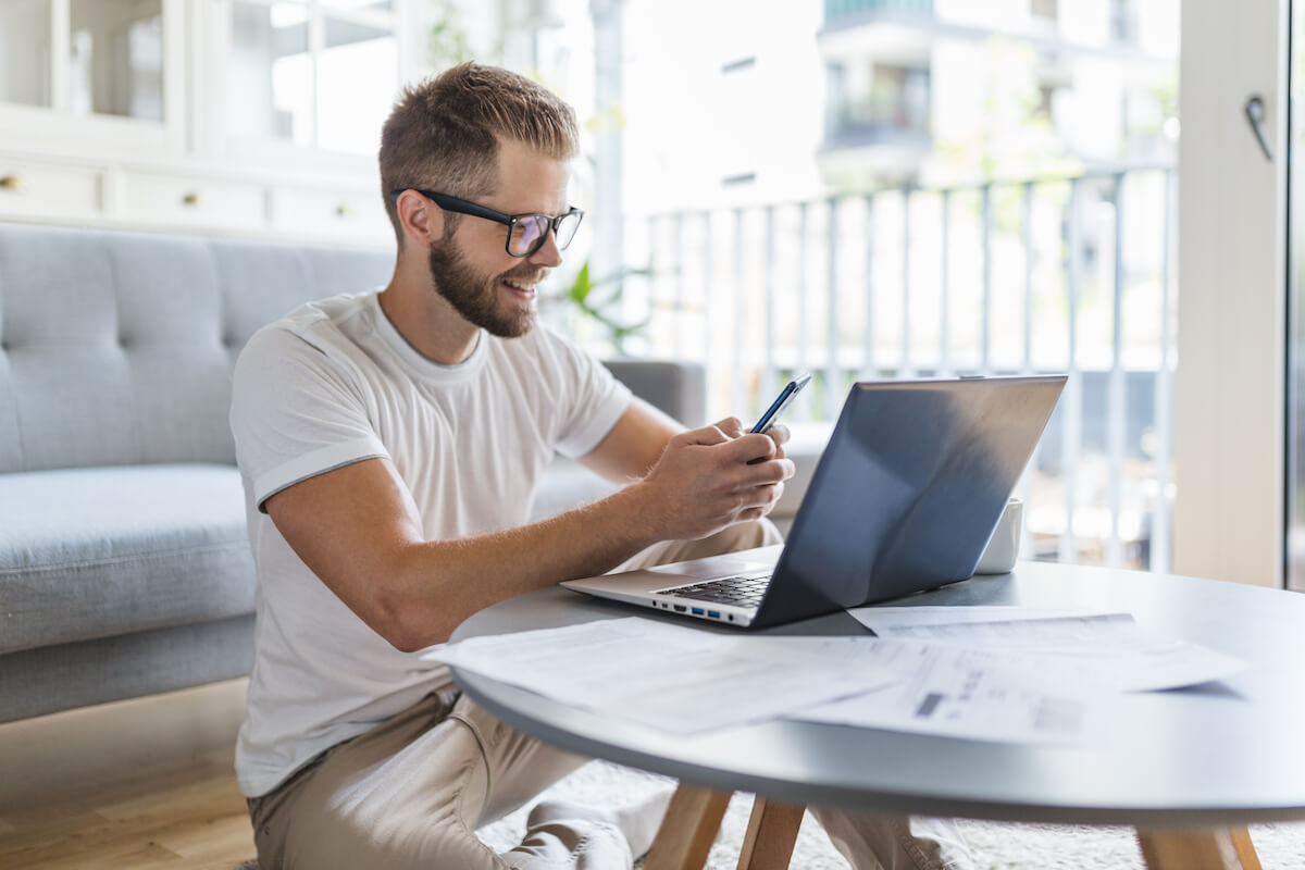 Employee happily working at home