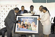 PICTURE PERFECT: Premier Zweli Mkhize signs a picture that showcases KwaZulu-Natal's readiness for the world soccer spectacle. With him are uGu municipality mayor Sthembiso Cele, eThekwini deputy mayor Loggie Naidoo, MEC for health Sibongiseni Dhlomo and MEC for cooperative governance and traditional affairs Nomusa Dube. Pic: Reinhardt Hartzenberg. 22/02/2010. © Unknown

KZN Premier Dr. Zweli Mkhize launching the 2010 Woza KZN Campaign.