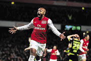 Thierry Henry, pictured here in file photo during his time with Arsenal, could be re-united with Gunners as soon as his playing days with MLS outfit New York Red Bulls comes to an end.