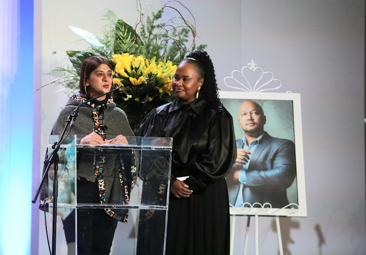 Zakira Mahomed, flanked by Sakina Kamwendo, addresses mourners of broadcaster and author Eusebius McKaiser and at his memorial service on Tuesday.