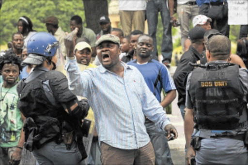 STAND-OFF: Congolese nationals take part in the protest march against President Jacob Zuma in Parliament recently. PHOTO: SHELLEY CHRISTIANS