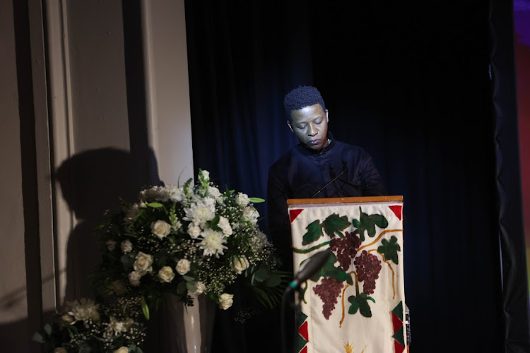 Friend Ruli Diseko becomes emotional while delivering an address at the memorial service.