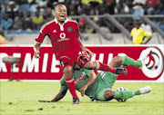 PAINFUL:
       Lehlohonolo Majoro of Orlando Pirates is tackled by Robyn Johannes of AmaZulu in a highly physical 
      
        Absa Premiership clash at the Moses Mabhida Stadium, Durban, last night  
      Photo: Anesh Debiky/Gallo Images