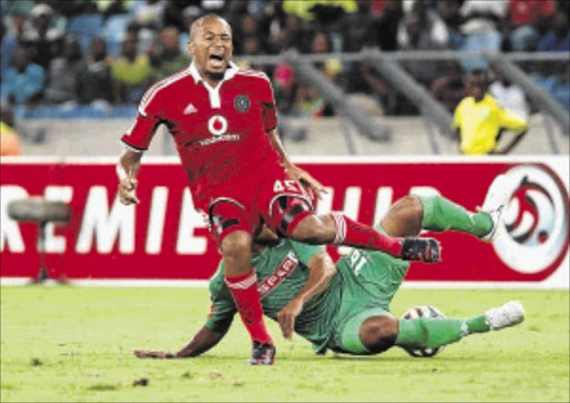 PAINFUL: Lehlohonolo Majoro of Orlando Pirates is tackled by Robyn Johannes of AmaZulu in a highly physical Absa Premiership clash at the Moses Mabhida Stadium, Durban, last night Photo: Anesh Debiky/Gallo Images