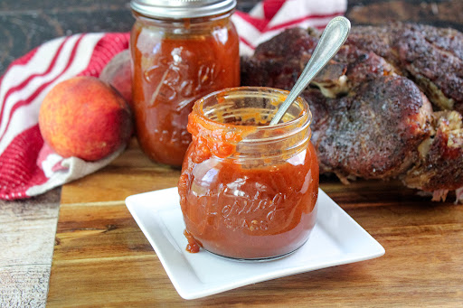 Jars of Southern Peach, Vidalia Onion, and Bourbon BBQ Sauce.