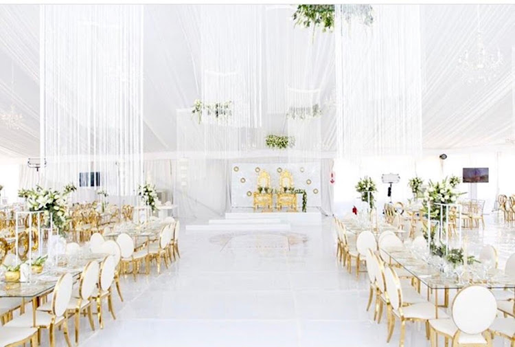 The opulent gold and white decor included a pair of thrones for the happy couple.