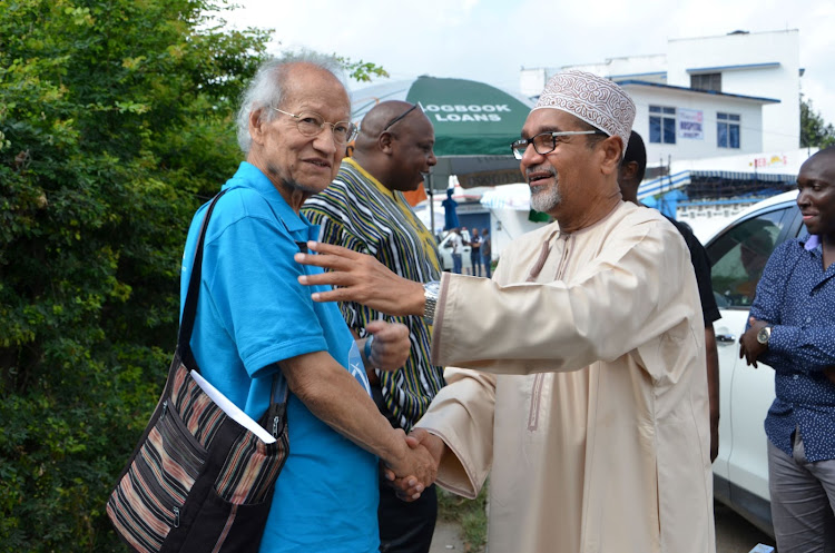 Yash Pal Ghai, Maina Kiai, Khelef Khalif and and David Ndii (partly hidden) outside the Technical University of Mombasa on Saturday