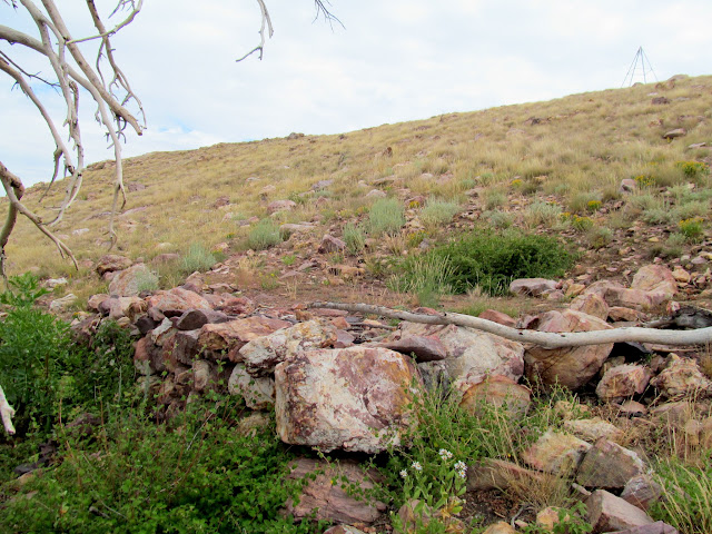 Retaining wall for an old tent pad