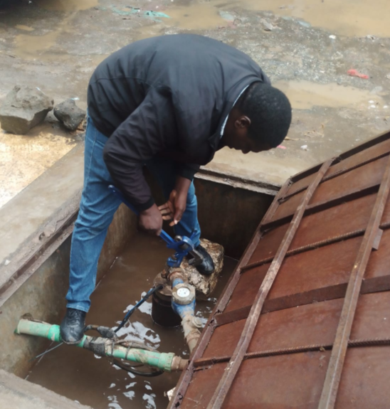 Nairobi City Water and Sewerage Company (NCWSC) staff disconnecting water supply